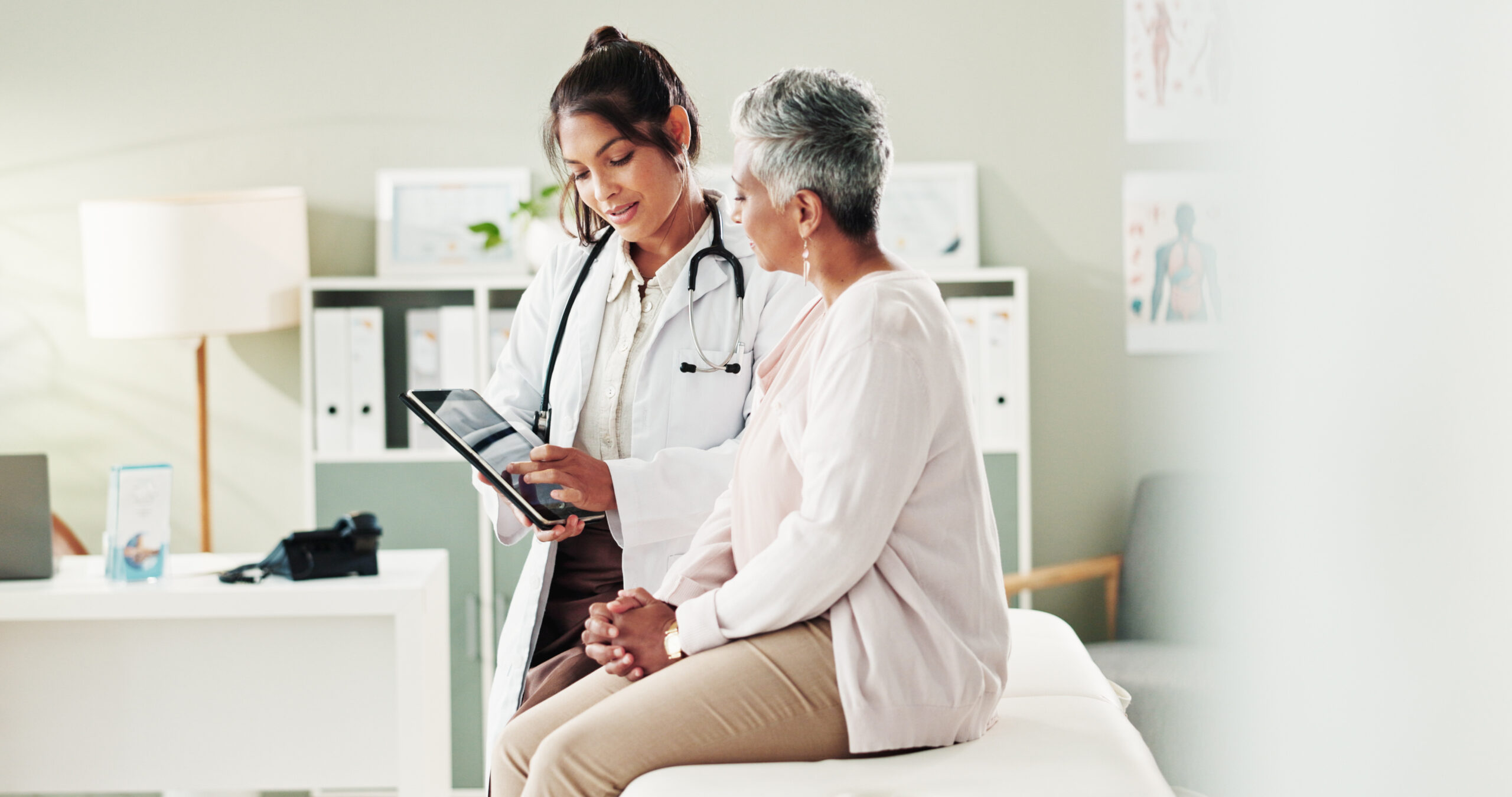 A doctor reviewing information with an older patient